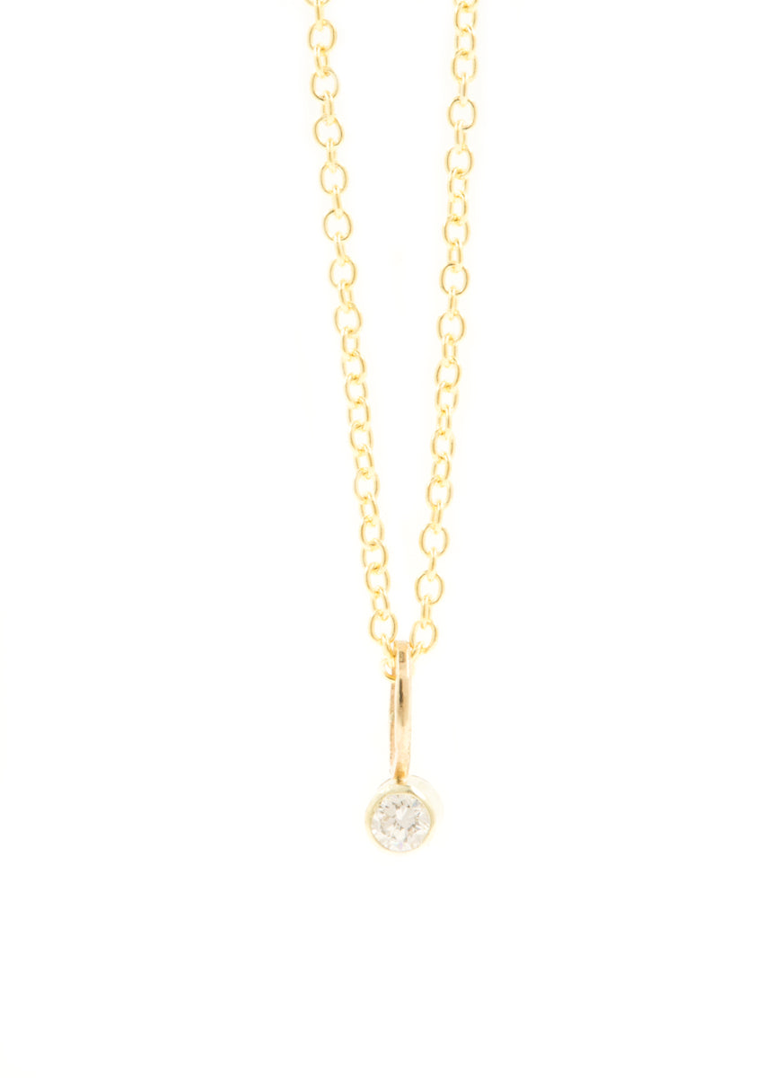 Handgemaakt gouden kettinkje met klein diamantje van 2 mm.